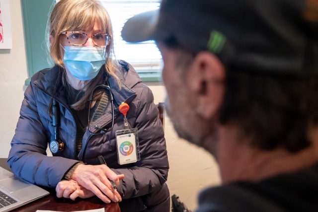 Kathy Kernan, a PeaceHealth nurse practitioner, meets with Jeffrey